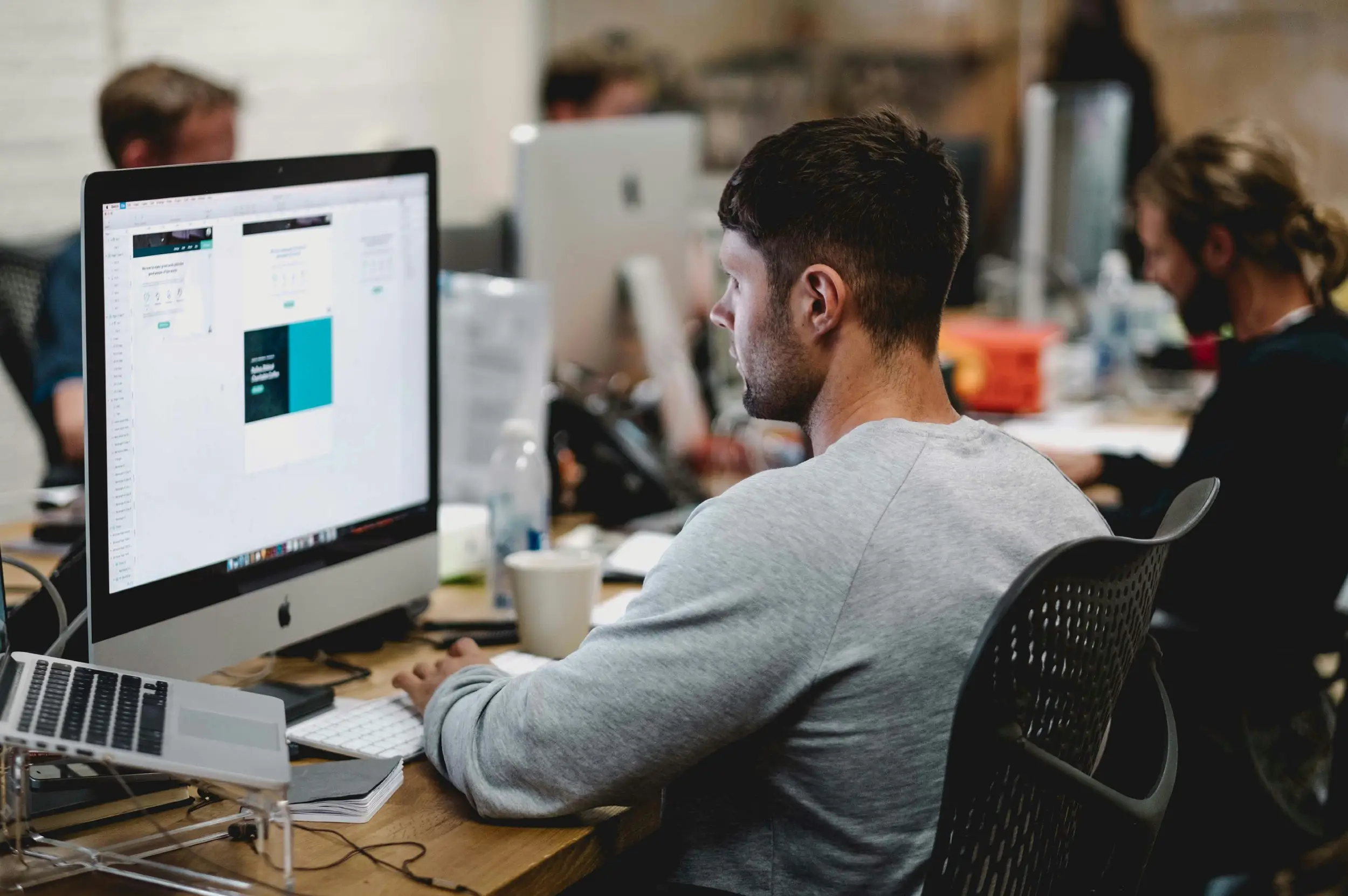 Developer designing the interface of a custom application at their desk